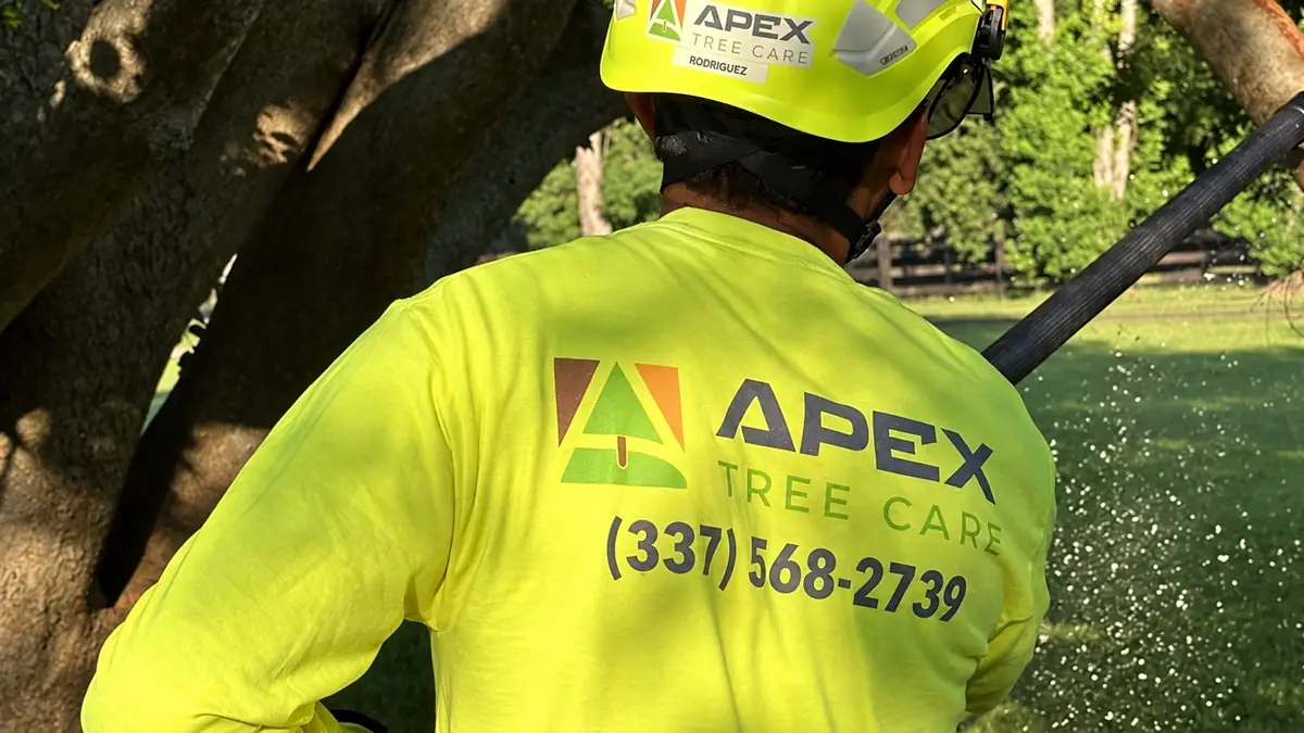 The back of an Apex crew shirt with the logo and phone number